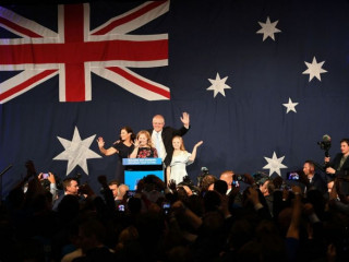 Australia\'s Prime Minister Scott Morrison waves to his supporters following a victory speech