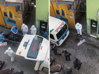 Authorities taking away the deceased