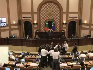 The Speaker named Vaikaradhoo MP Hussain Ziyad, Galolhu South MP Meekail Ahmed Naseem, and Keyodhoo MP Mohamed Niushad following a protest by MDP members in front of the administrative desk on 10 February 2026. | People's Majlis