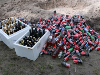 Alcohol bottles in Kudahuvadhoo Police Station custody, destroyed
