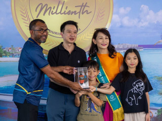 One millionth tourist of the year with her family