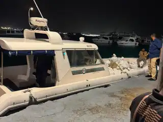 The bags of sea cucumbers are being transported to Dhoonidhoo under police custody. | RaajjeMV