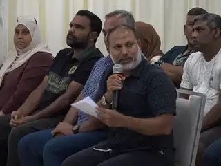 Former Home Minister Sheikh Imran Abdulla speaks from the audience during the "Dhivehinge Bin Dhivehinnah" special forum held on Saturday night.
