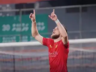 Victory's player celebrates after scoring in the match