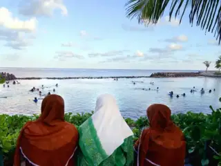 Women seated at the Artificial Beach in Malé, 15 October 2003.