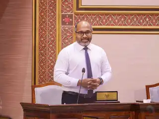 Home Minister Ihusaan speaking during a sitting of the People's Majlis.