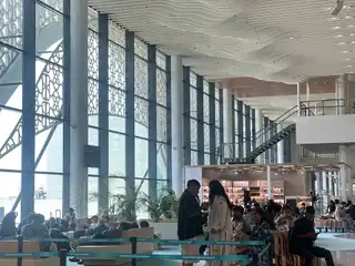 Passengers waiting inside Velana International Airport.