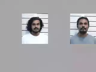 The two men arrested with suspected drugs from a house in the capital city