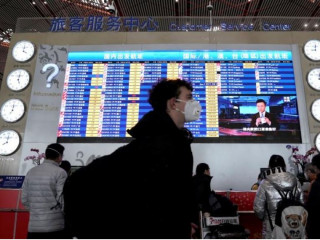 ބެއިޖިންގ ގެ އެއަރޕޯޓް ގައި ފަސިންޖަރަކު މާސްކު އަޅައިގެން