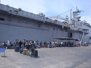 Those approved to return home to India via INS Jalashwa embark ship