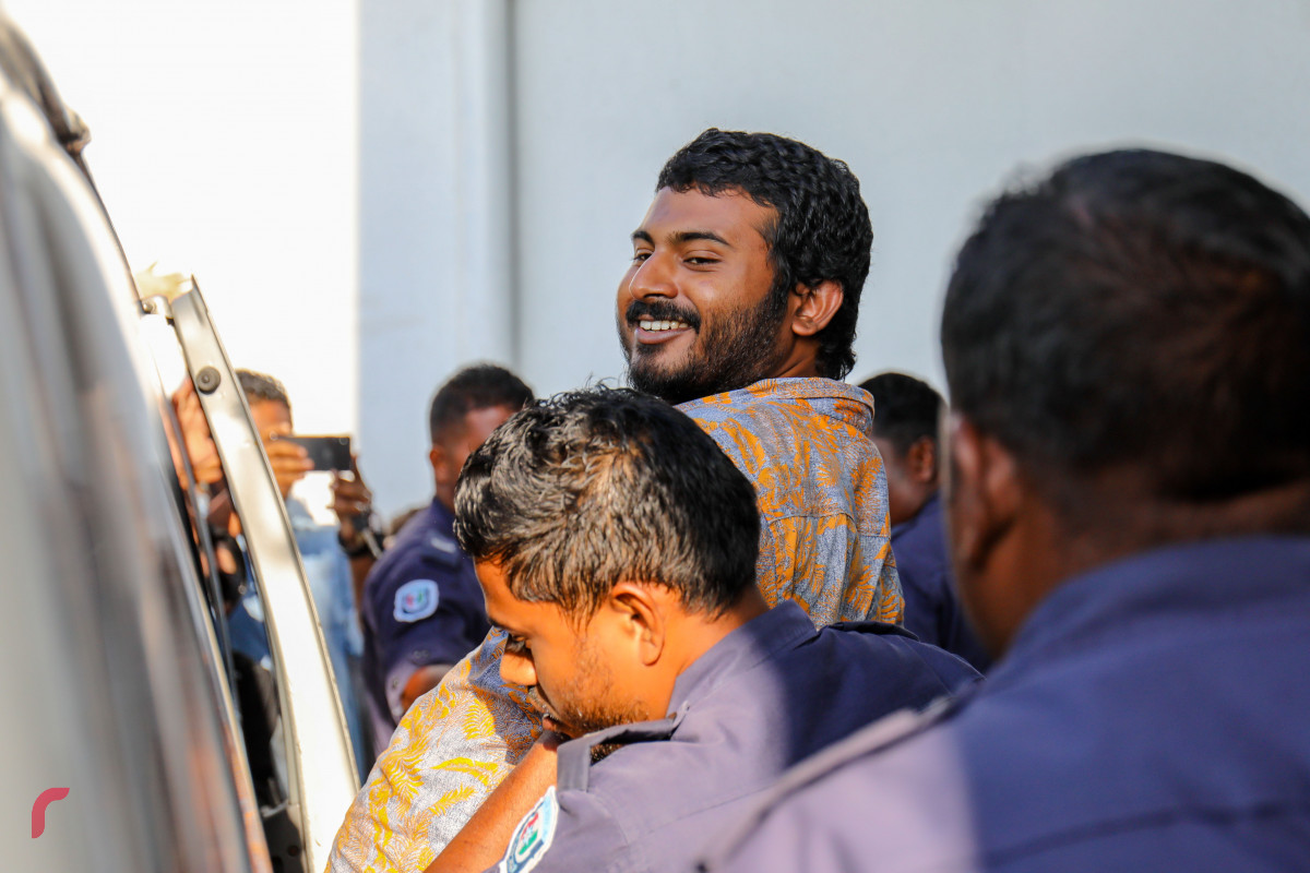 Police escort journalist Mohamed Wisam