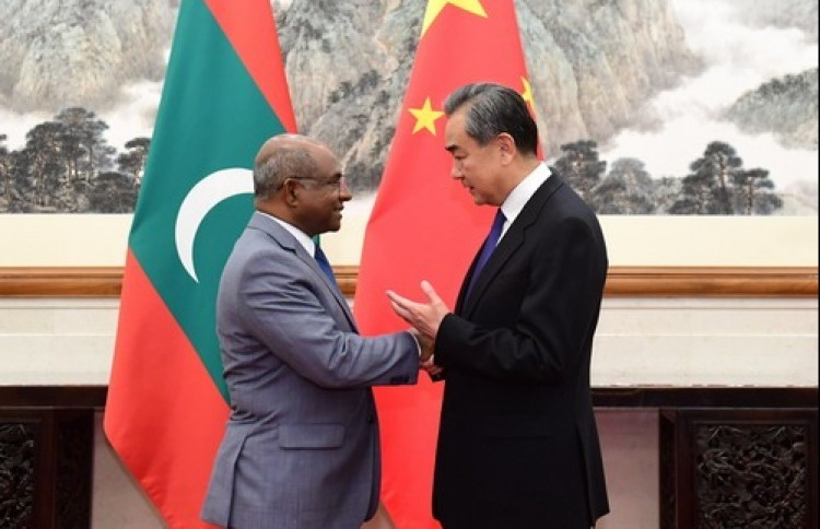 Maldivian Foreign Minister Abdulla Shahid and the Chinese Foreign Minister Wang Yi