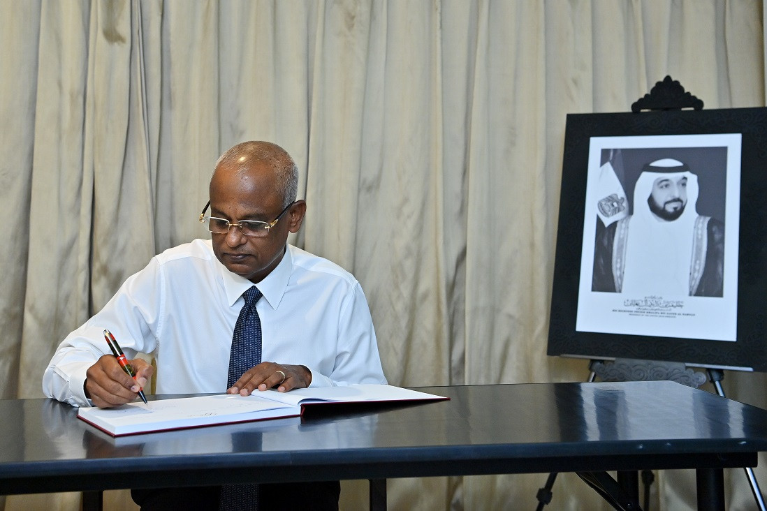 The President signs the book of condolences open in memory of the late President of UAE