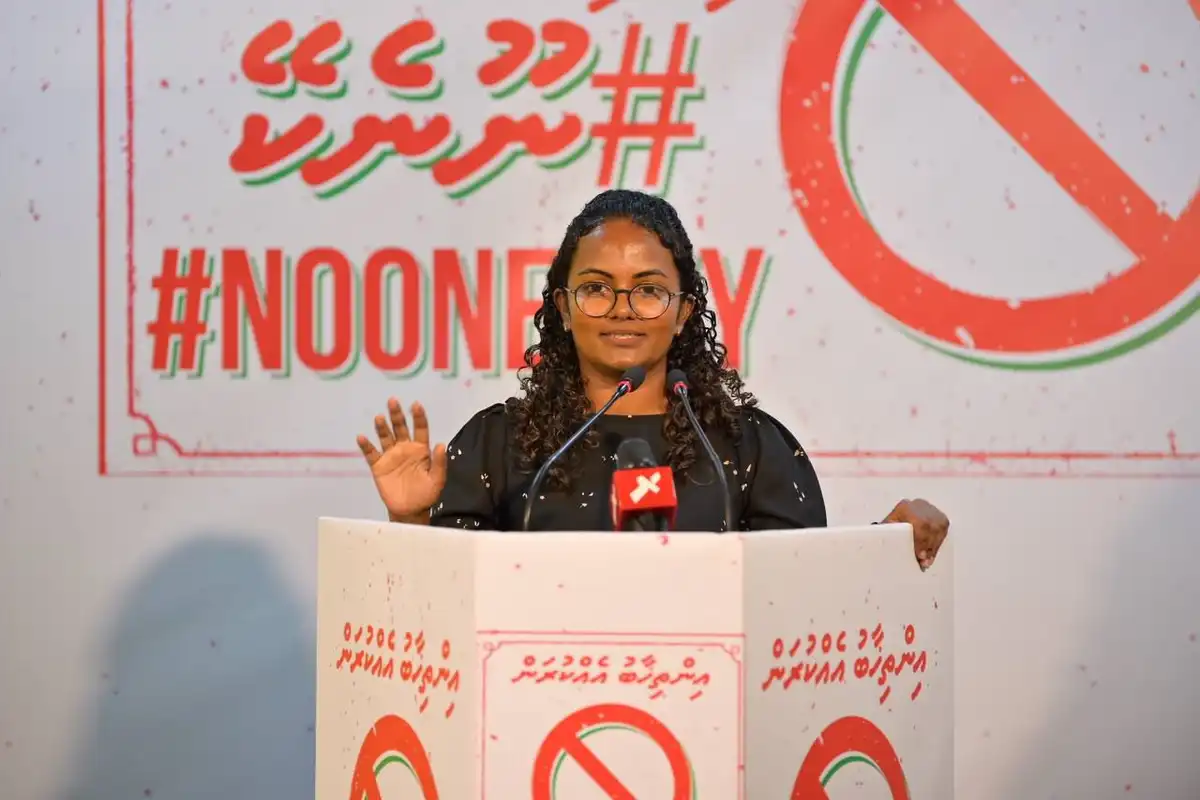 Former Minister Aminath Shauna addresses an MDP rally held at the party's headquarters. | MDP
