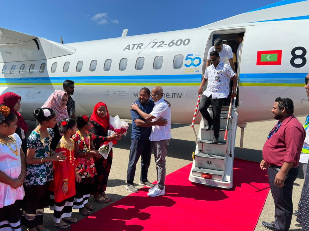 President Ibrahim Mohamed Solih embraces JP leader Gasim Ibrahim upon arrival in Maamigili