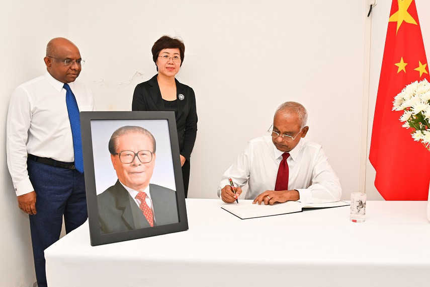 The President signs book of condolences for the late Chinese President Jiang Zemin