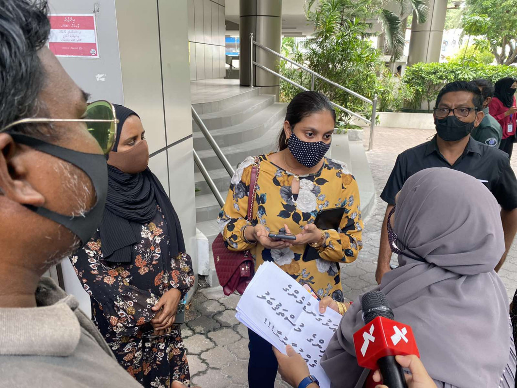 Minister of Education Dr. Aishath Ali met with protestors outside the Education Ministry on Monday afternoon