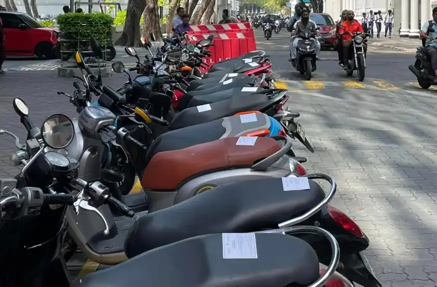 Parking stickers on motorcycles near Velaanaage