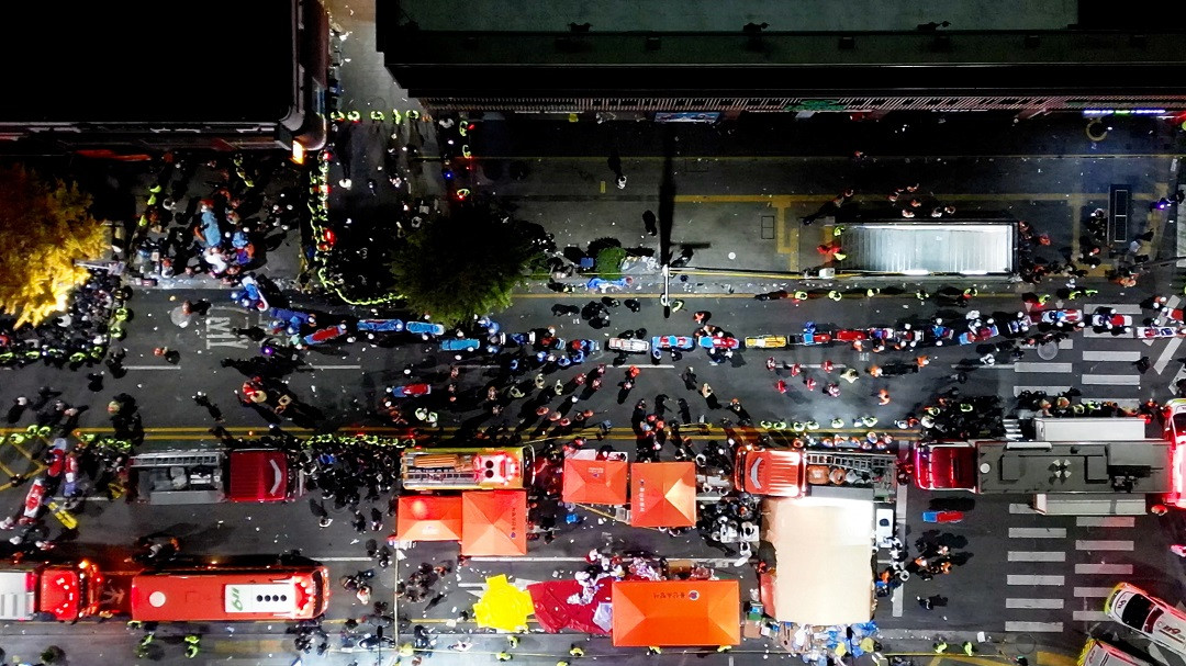 Rescue workers work at the scene where a stampede during Halloween festivities killed and injured many people at the popular Itaewon district in Seoul, South Korea