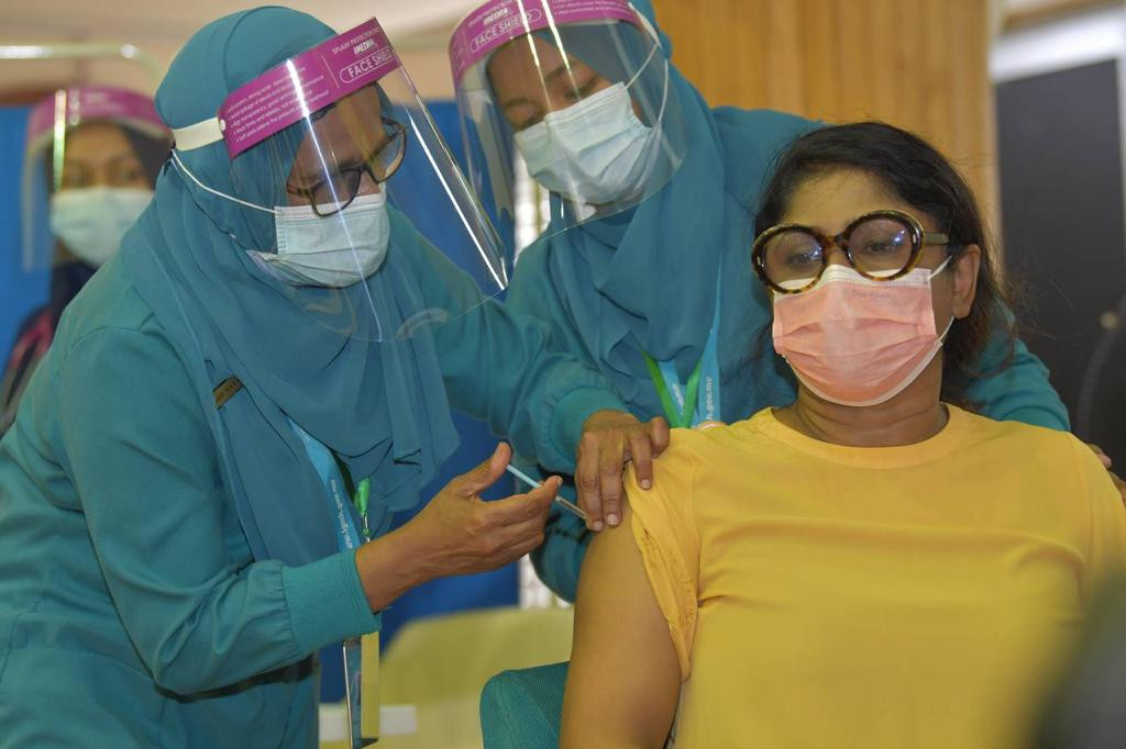 Chair of the National Emergency Operations Center and Defence Minister, Mariya Ahmed Didi receives first dose of Covishield vaccine on Monday