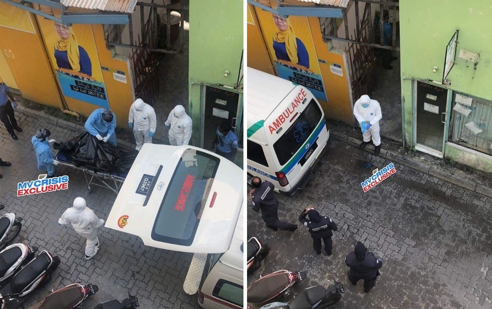 Authorities taking away the deceased