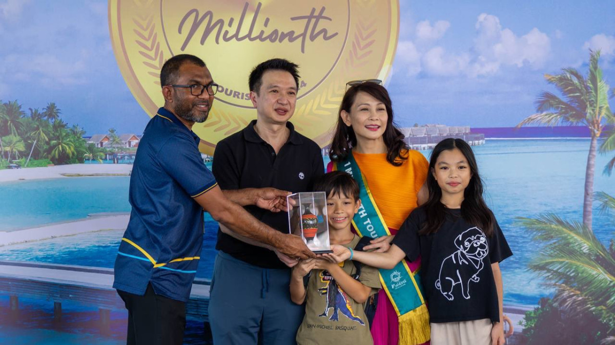 One millionth tourist of the year with her family