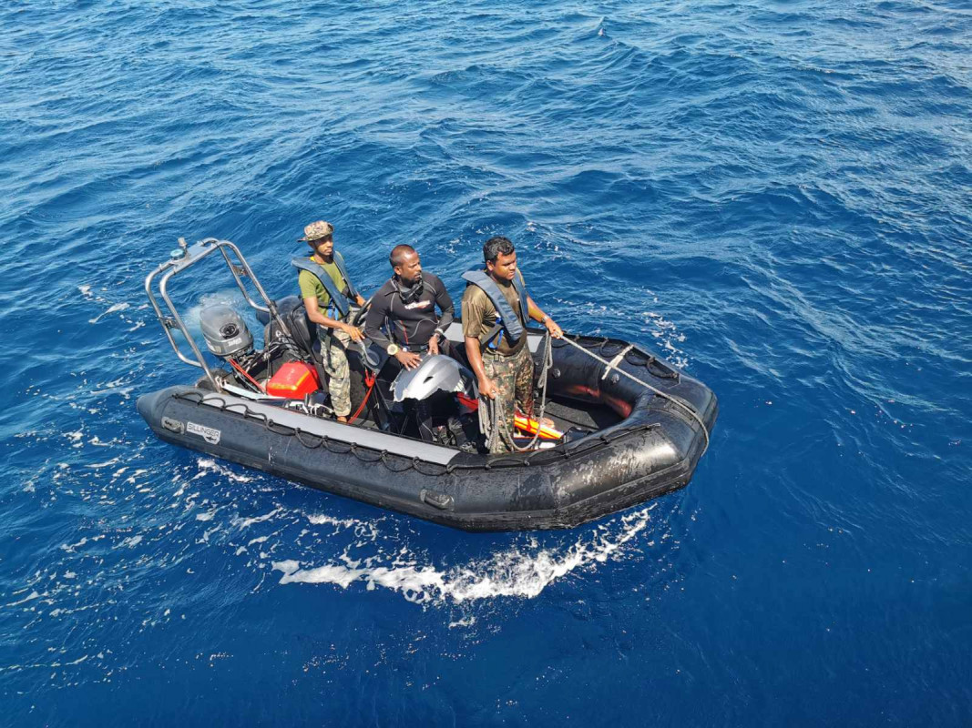 MNDF working to resurface the chunk of the dinghy