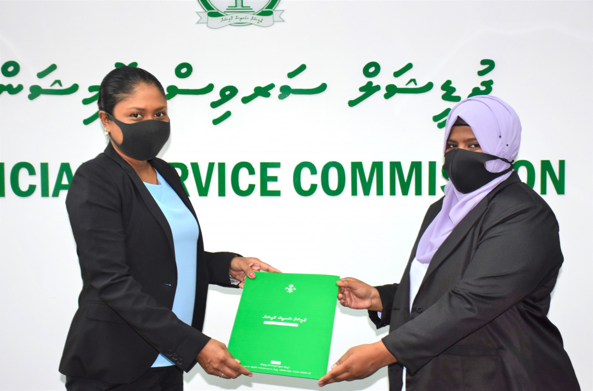 Fathimath Faruheeza being presented her letter of appointment.